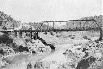 Freighter on Moffitt’s Bridge, Big Oak Flat Road, descending hill on left. Jacksonville in distance, center.