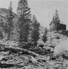 RUINS OF BOARDINGHOUSE BARN AT RIGHT