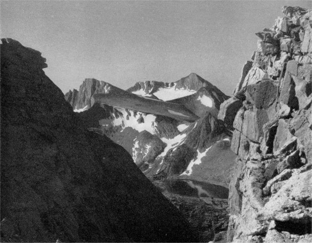 Ancient landscape on North Peak, Mount Conness in right background. Taken from the top of the avalanche chute at the head of Little Lost Valley. The nivated slope of North Peak contrasts strikingly with the glacial sculpture roundabout. By Alfred Dole