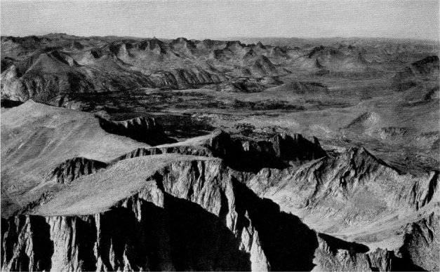 Aerial view of Mount Whitney and the Upper Kern Basin, with Table Mountain in the distance. By Roy Curtis. Reno, Nevada