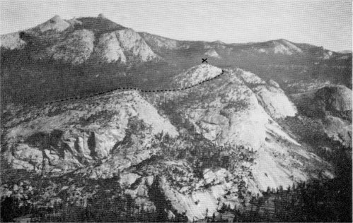 General view of north side of Little Yosemite Valley. Moraine Dome in the center, marked by a cross. The great morainal embankment is accentuated by a row of dots. In the background is Clouds Rest. The faint, white horizontal line to the right of Moraine Dome is the boulder-studded crest of the highest moraine of the later ice flood. The earlier ice flood overtopped most of the low mountains along the sky line.