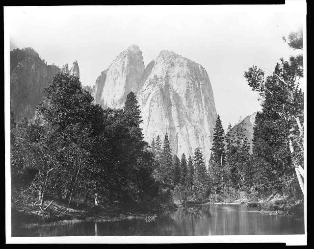 Cathedral Rock and spire, with lake and trees in foreground