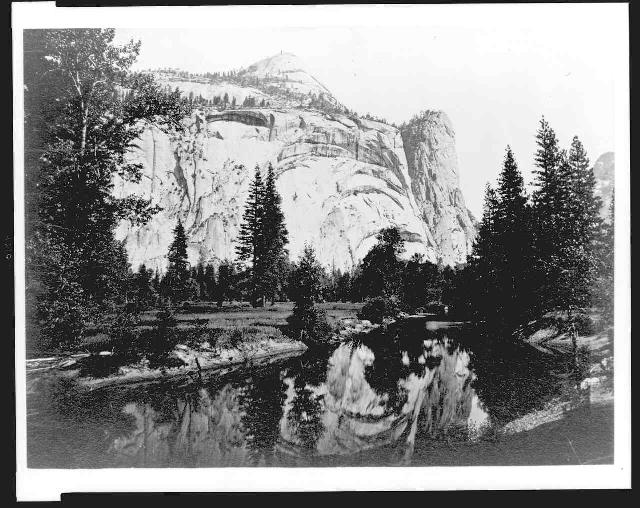 Reflection of trees and Washington Column in lake