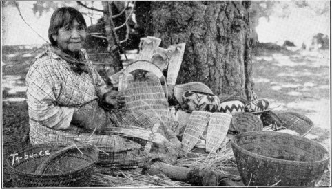 Ta-bu-ce (Maggie Howard) and baskets. Boysen photo