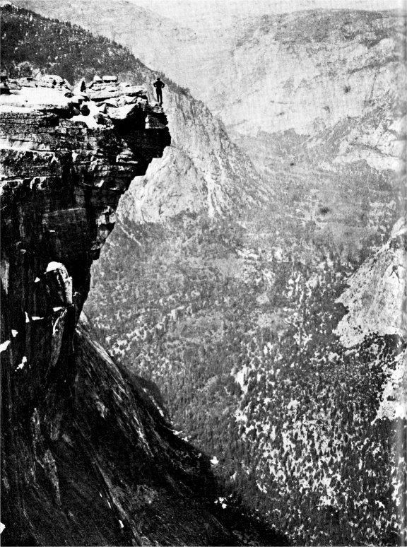 The figure standing near the lip of Half Dome is thought to be George Anderson.