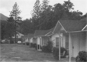 Illustration 270. El Portal Motor Inn cabins, hotel in background. Photo by Robert C. Pavlik, 1984