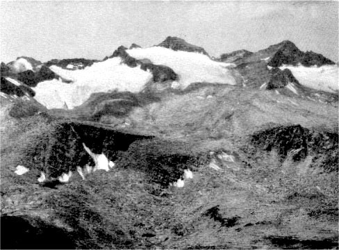 Mount Lyell and Mount Maclure from Mount Dana, an empire of stark granite peaks tumbled together in desolate grandeur. By Ansel Adams