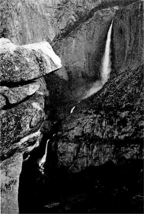 From Glacier Point the flash of Yosemite Falls and the sound of its thunder dominate the entire Valley. By Ansel Adams